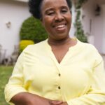 portrait-happy-senior-african-american-woman-wearing-yellow-shirt-garden-home_13339-369984.jpg